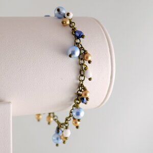 Cluster Bracelet with Light Blue and Bronze Pearls in Antiqued Brass